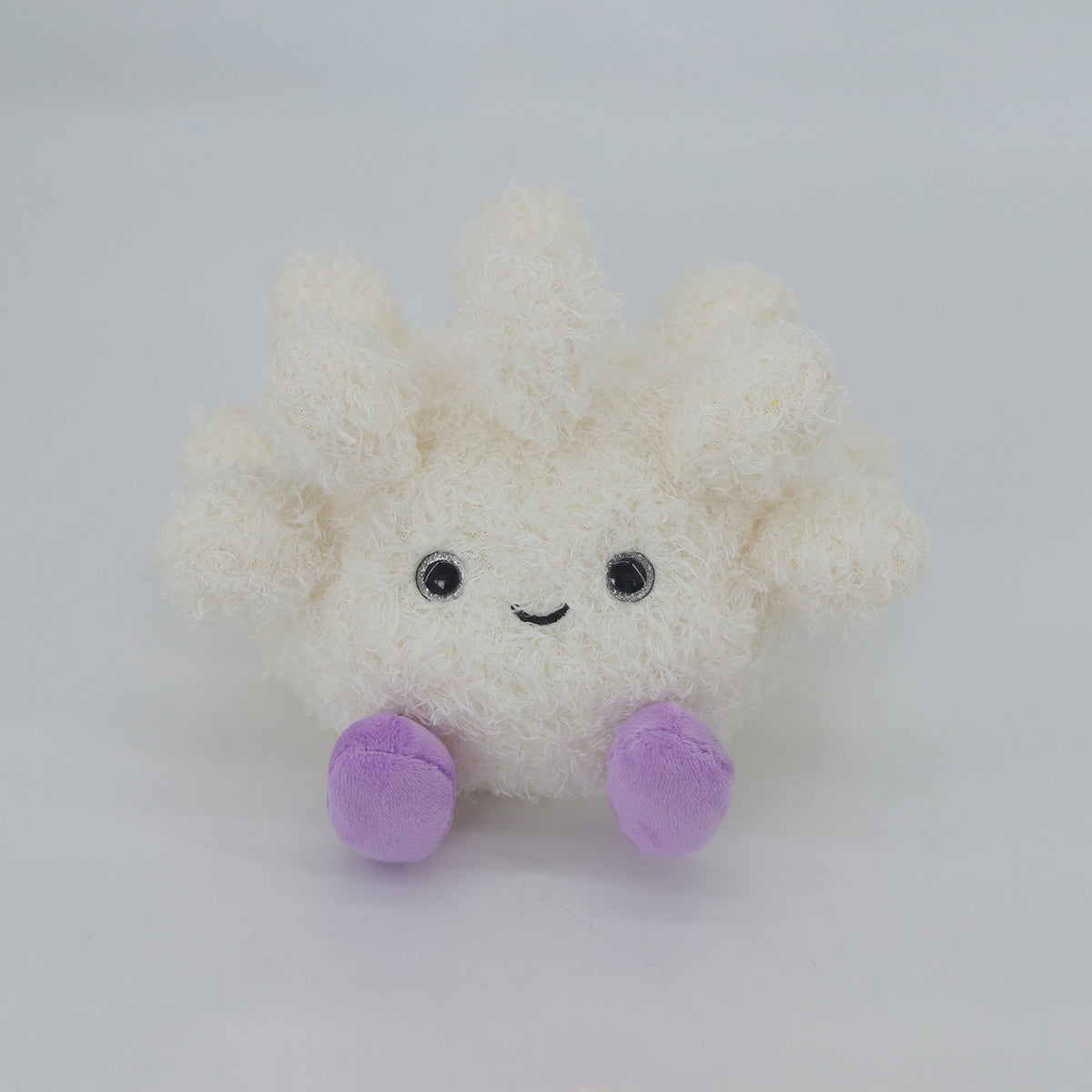 Coral soft toy with purple feet