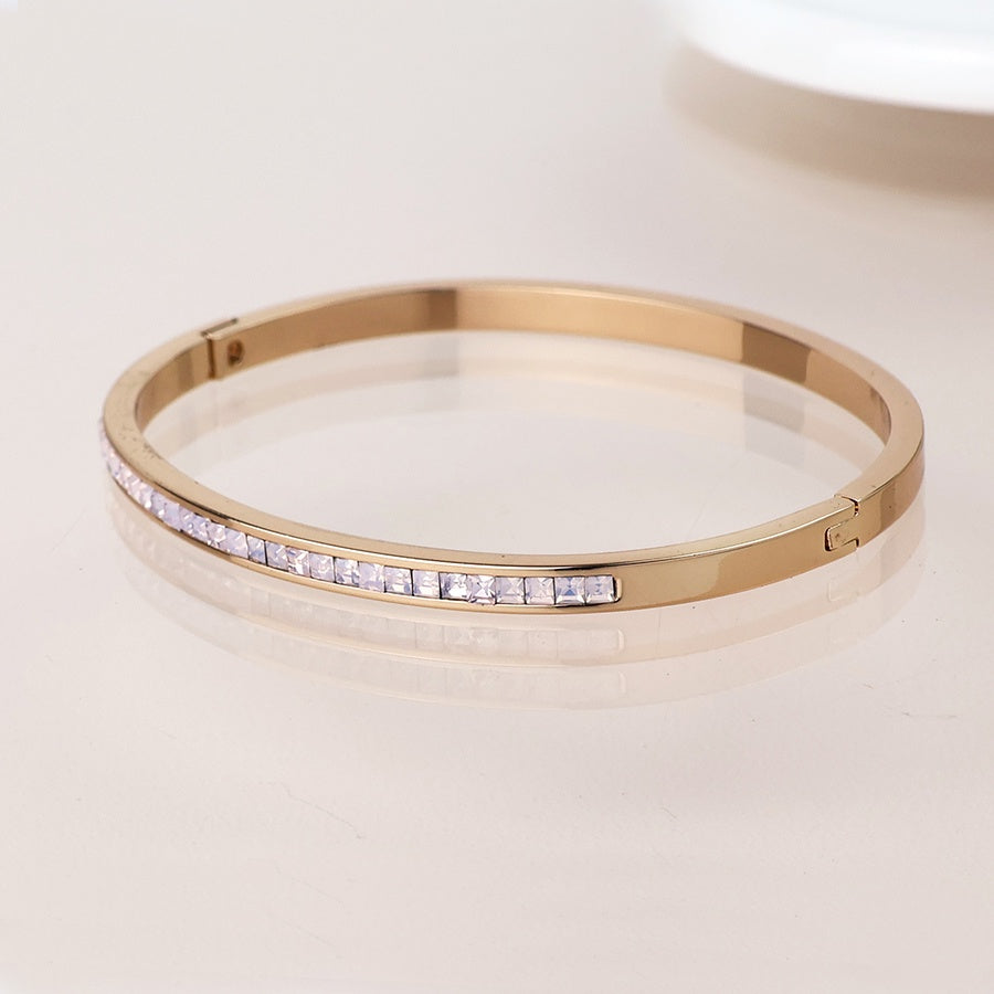 Faux gold plated plated slim hinged bangle with pastel pink crystals