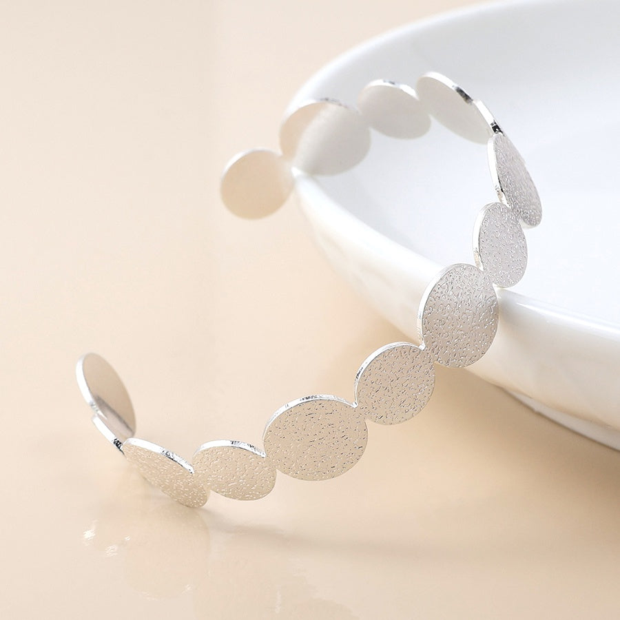 Brushed textured silver plated discs open back bangle