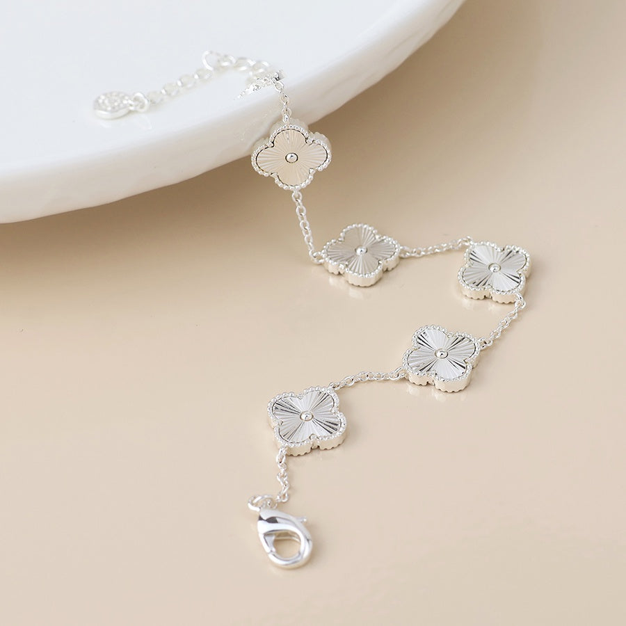 Silver plated quatrefoil station bracelet