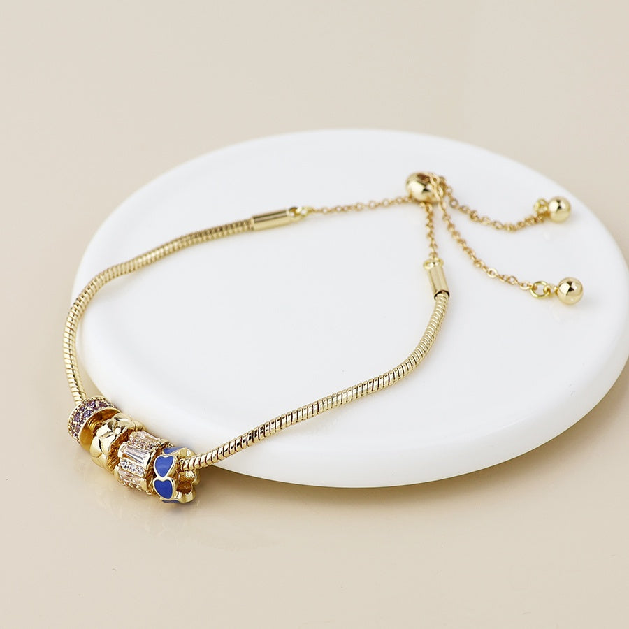 Faux gold multi ring snake bracelet with crystals and hearts
