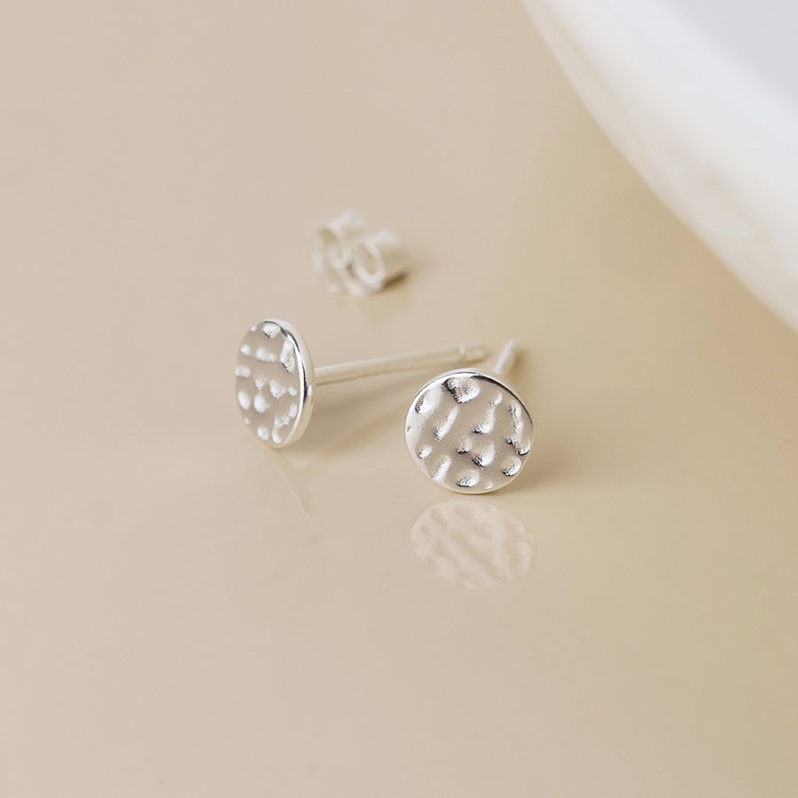 Sterling silver beaten disc stud earrings
